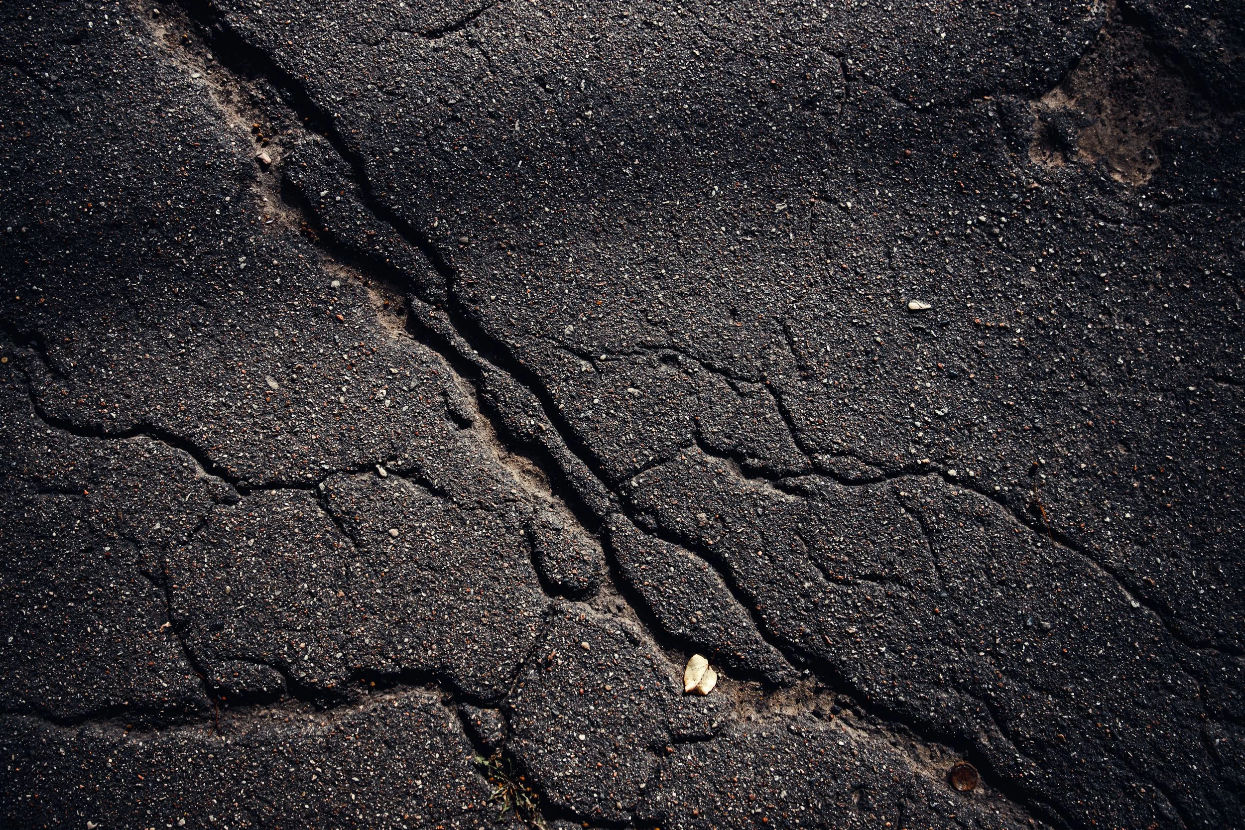 Close view of a weathered asphalt surface in Idaho