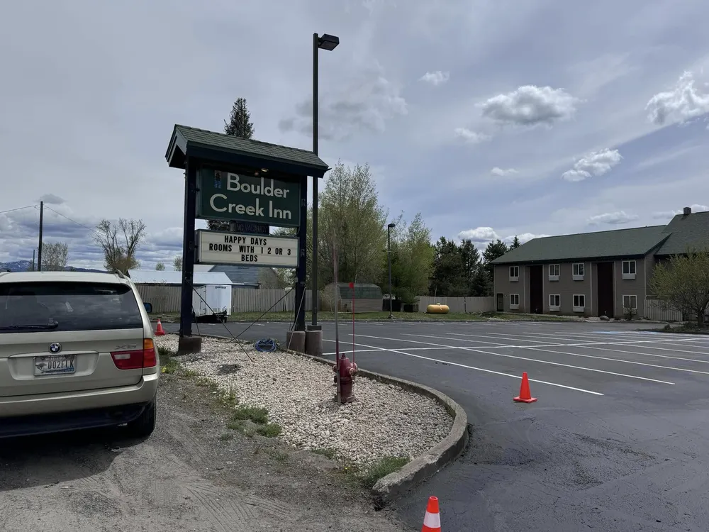 Fresh white parking stripe on completed black asphalt in the Treasure Valley