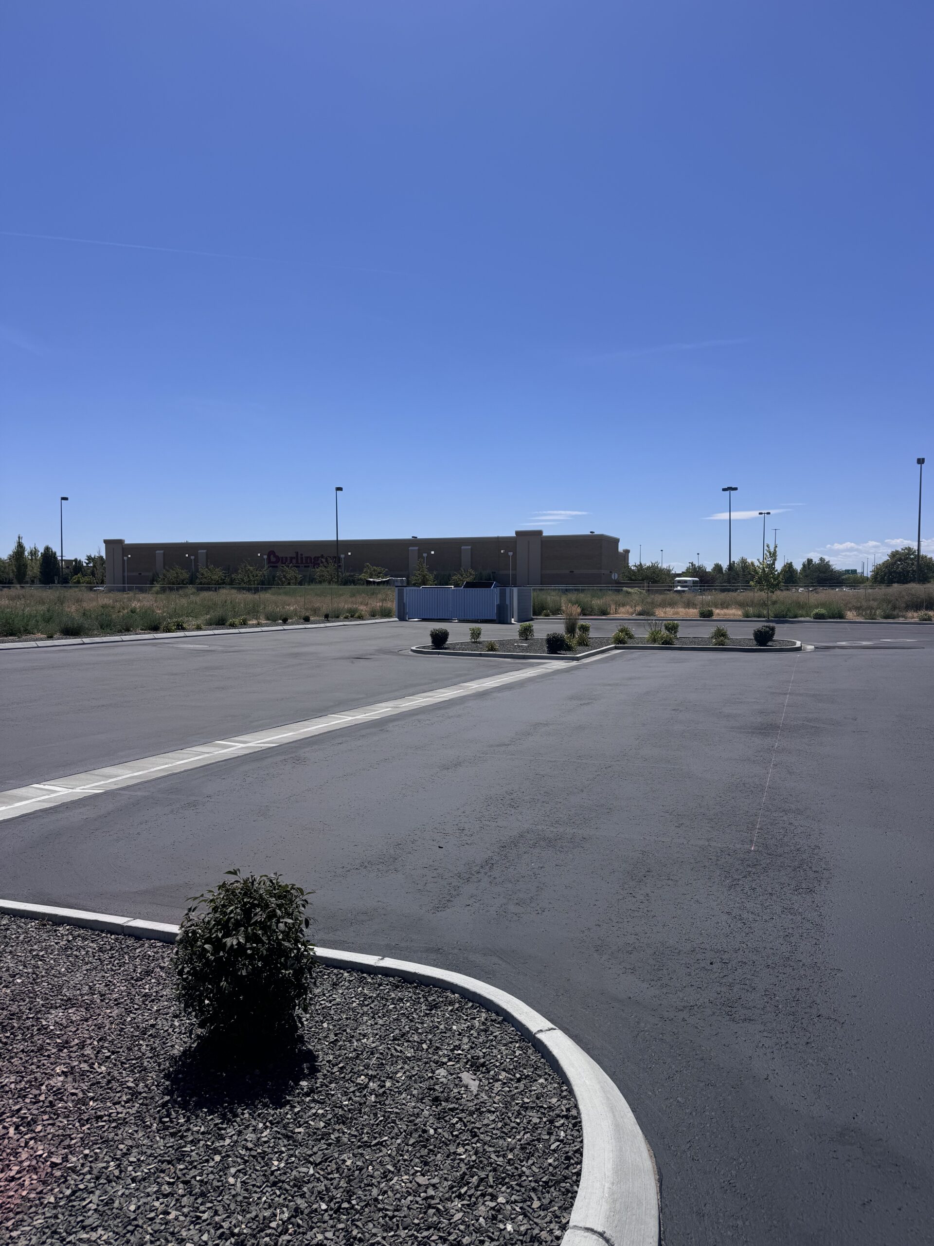 Sealcoat application on large asphalt lot