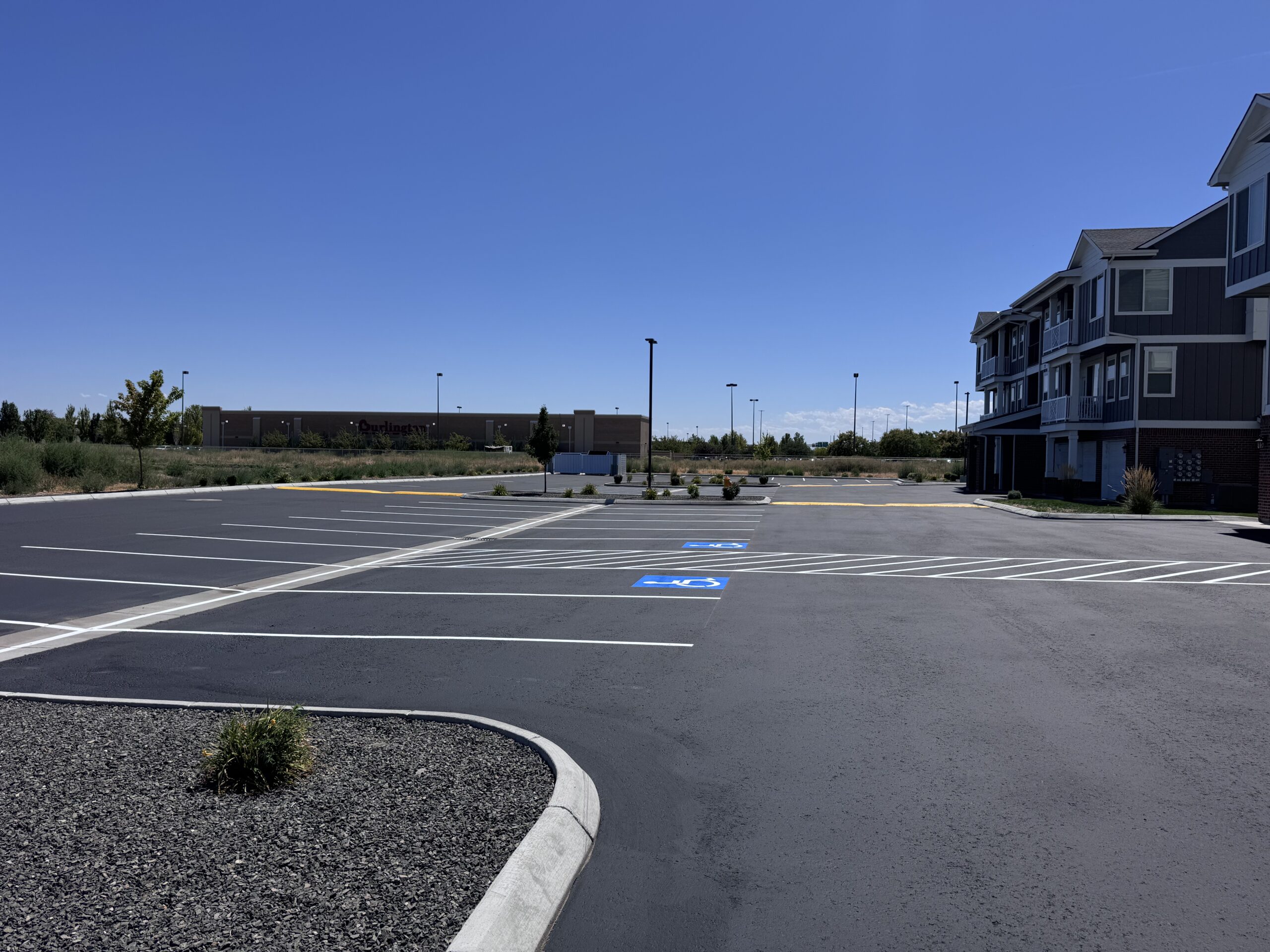 New asphalt speed bump installation